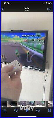 Nintendo Wii 2 Player Bundle, Mario Kart, Wii Fit Board. Retro games Installed